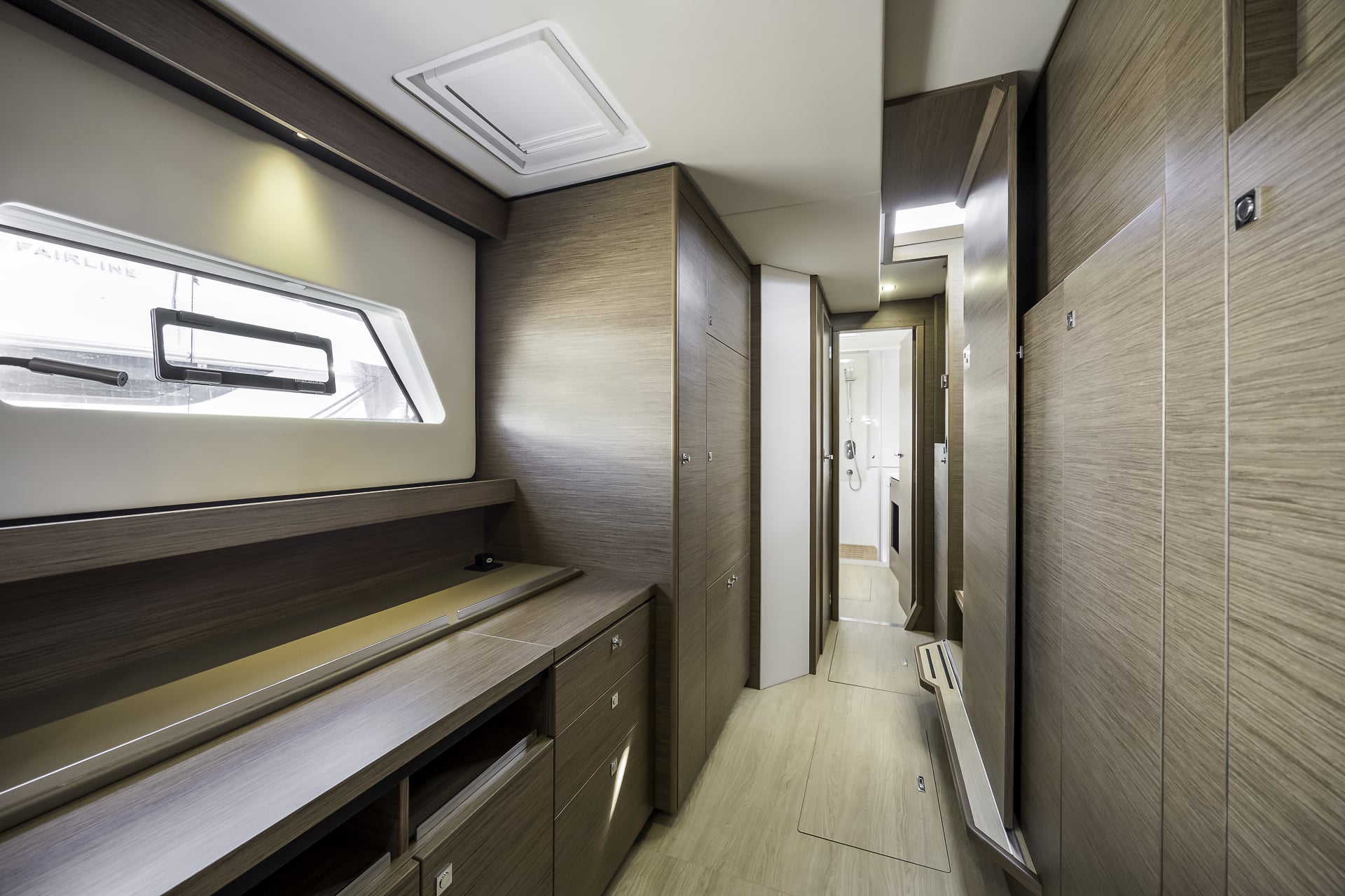 Port hull guest accommodation aboard the Seven Days luxury catamaran, featuring a main double cabin with private ensuite bathroom.