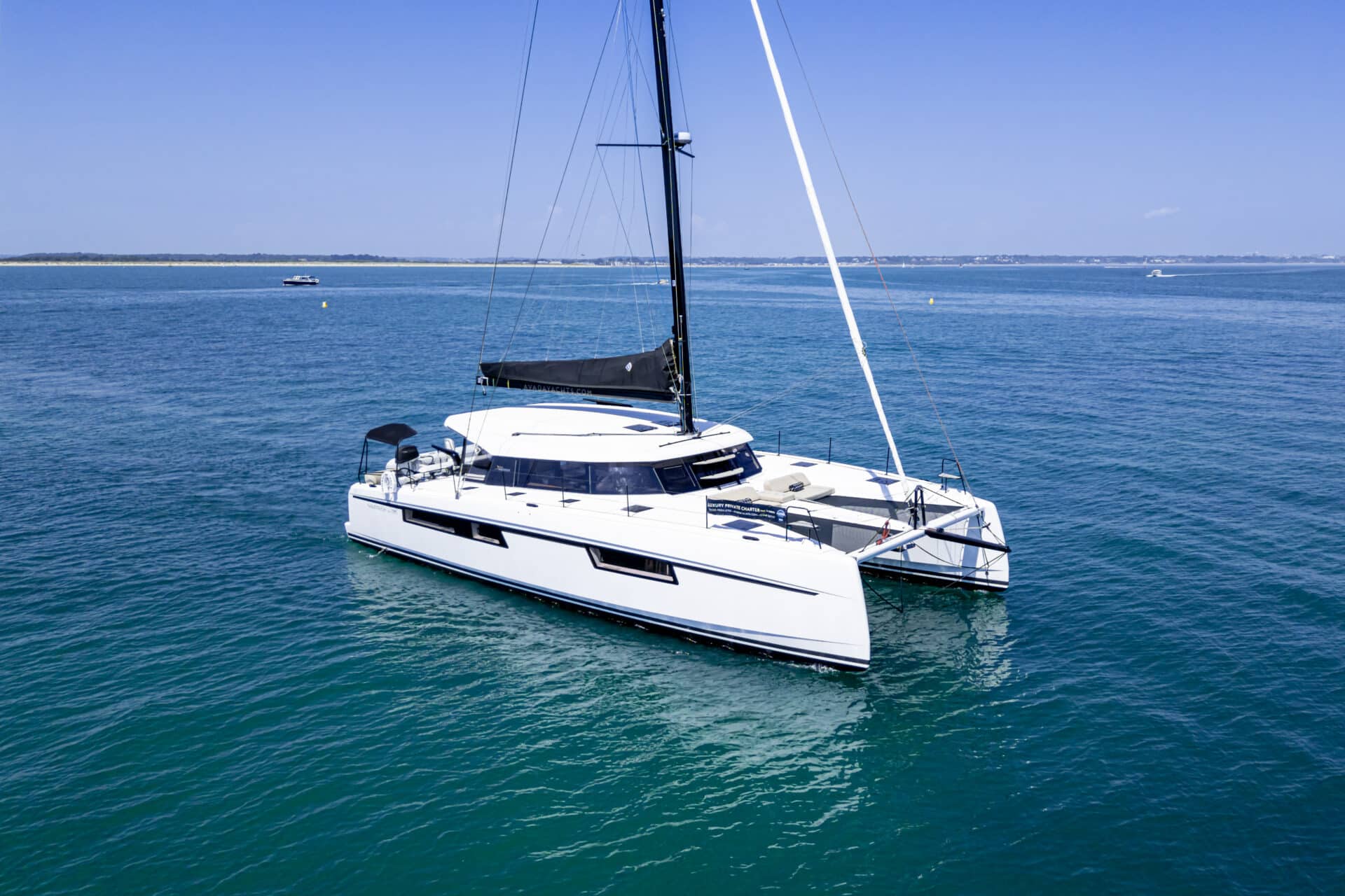 Private yacht charter aboard the Seven Days luxury catamaran in Poole Harbour on the Dorset Coast.